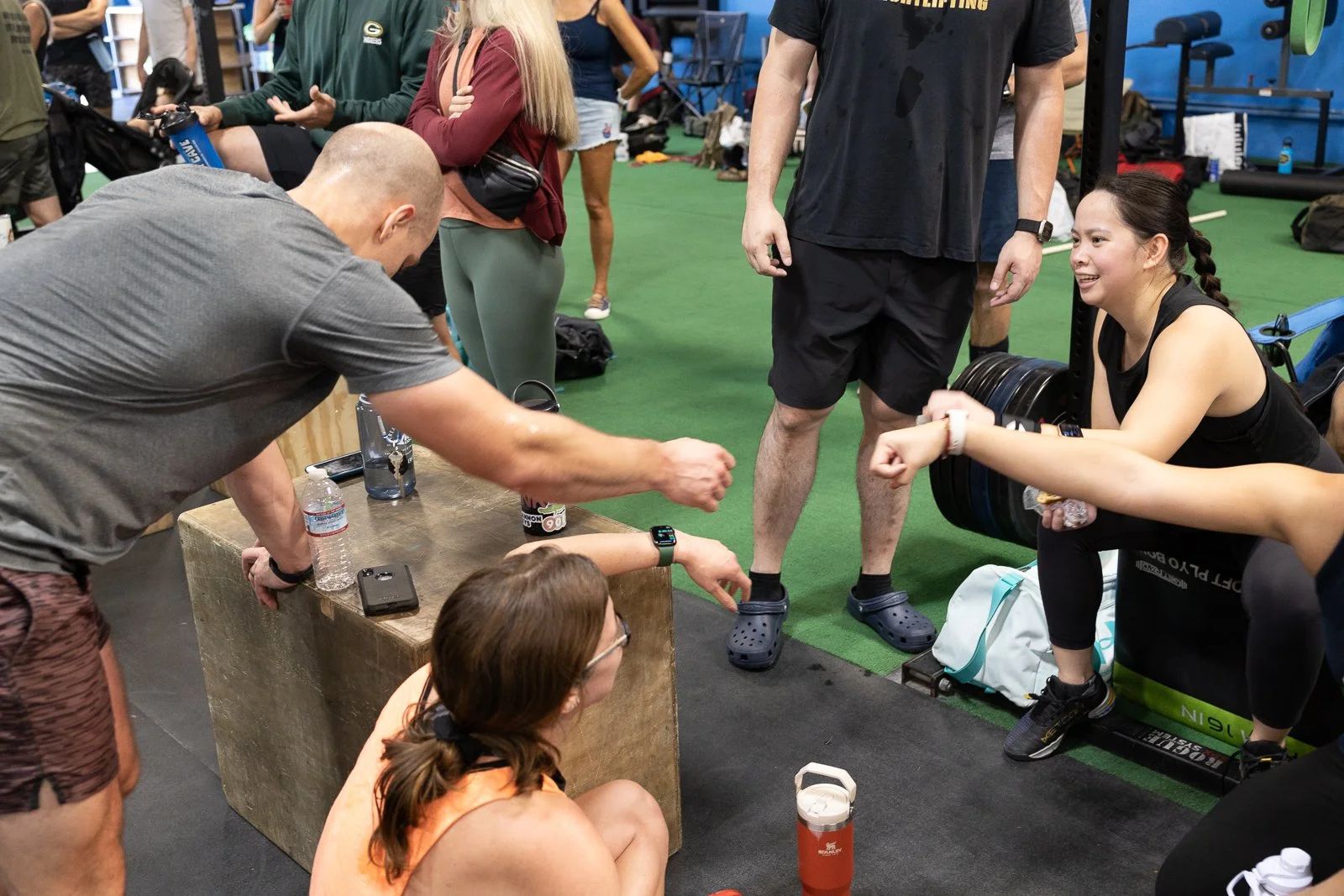 Resolution CrossFit members connecting in a welcoming community setting