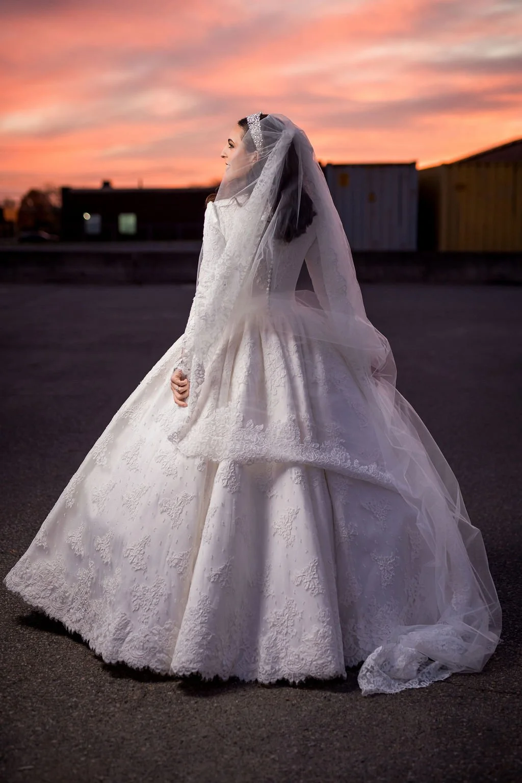 Portrait of a bride looking away, under a beautiful sunset sky 