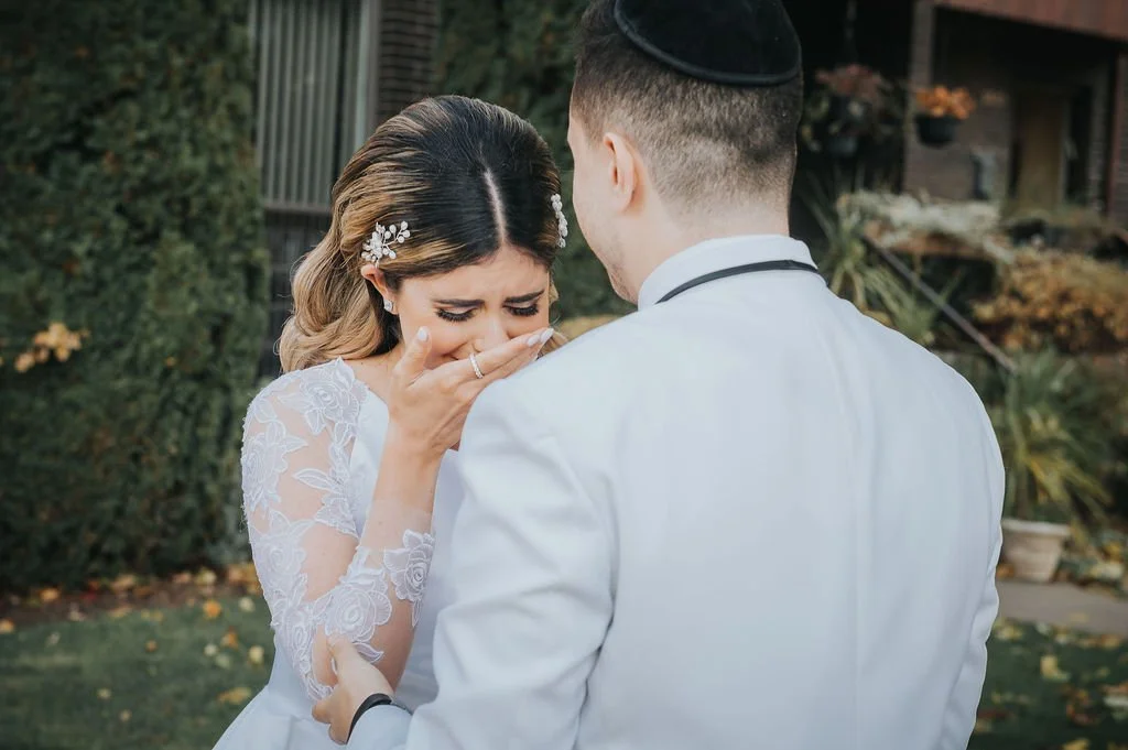 A Montreal bride reacting emotionally when seeing her groom for the first time, by a wedding photographer in Montreal