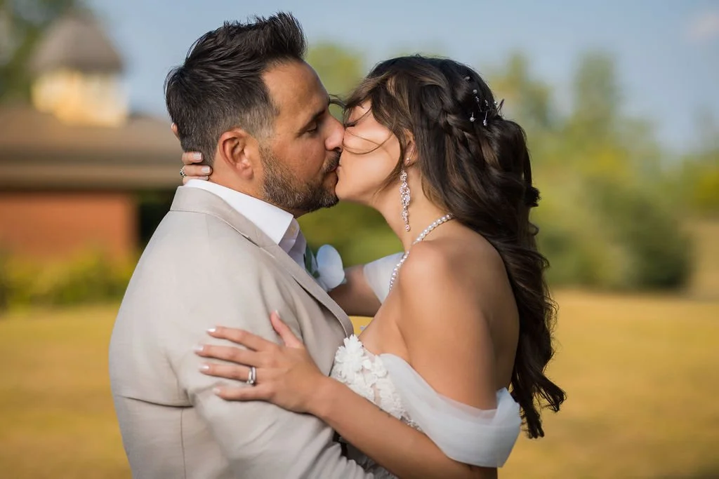 A Montreal Bride and Groom in a passionate kiss, on their wedding day