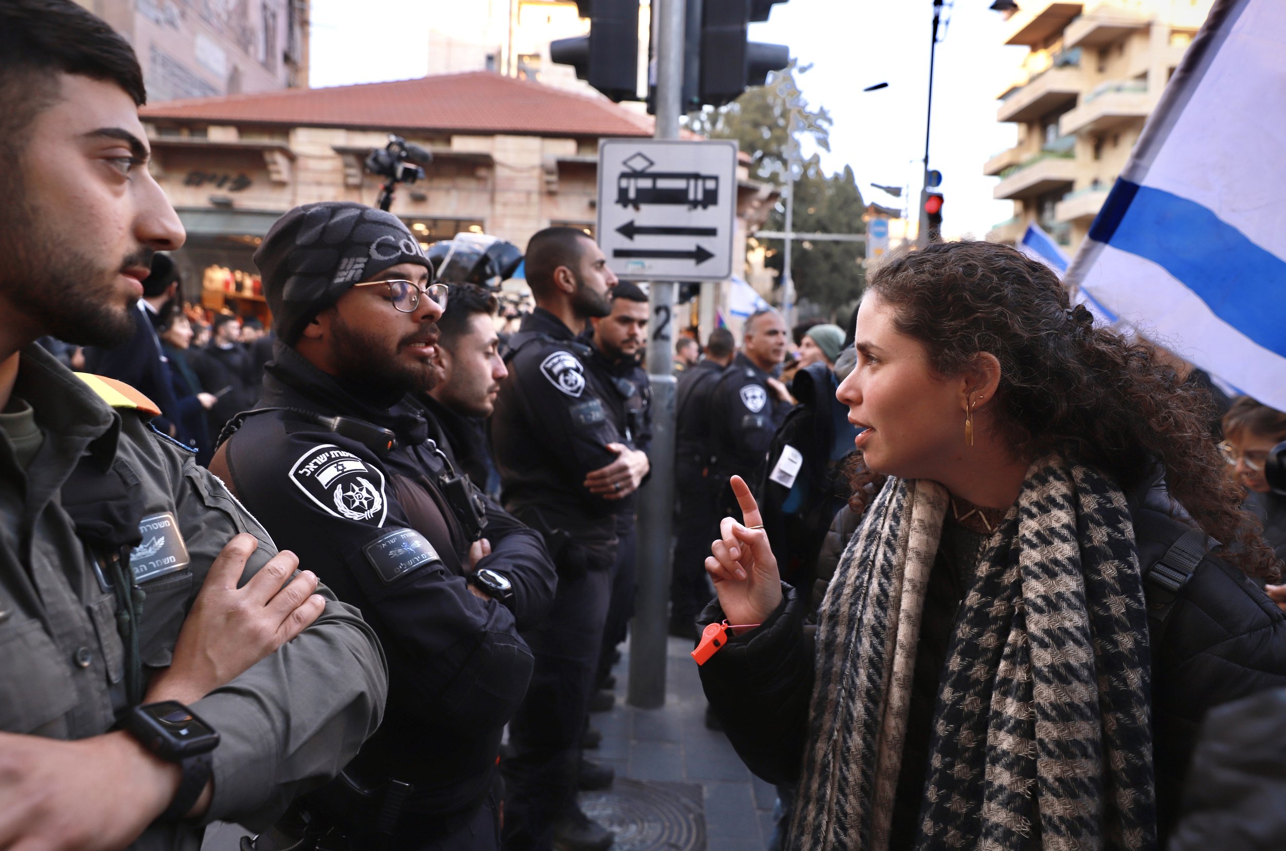 A young Israeli woman faces off with police during a Jerusalem protest against a judicial overhaul proposed by the coalition of Prime Minister Netanyahu. February 2023.
