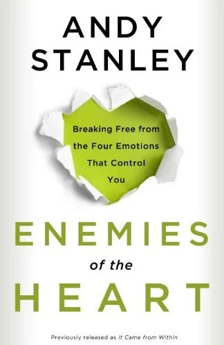 Cover of the book 'Enemies of the Heart' by Andy Stanley, featuring a torn paper revealing a green background with text.