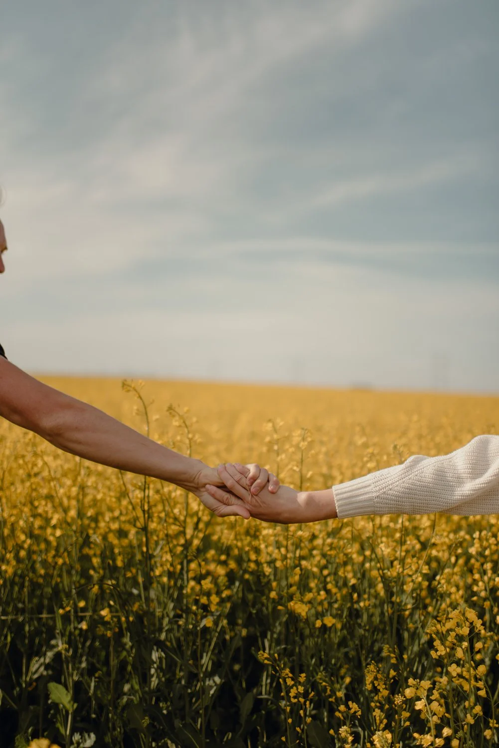 Professional adventure photography in Spokane, Washington - lifestyle portrait Canola flower fields