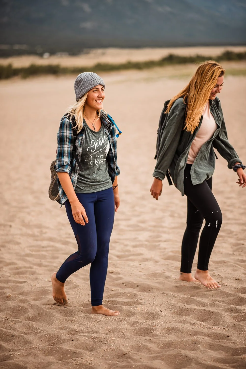 Adventure lifestyle product photography of friends playing in Great Sand Dunes National Park in Colorado for Akinz Boardwear