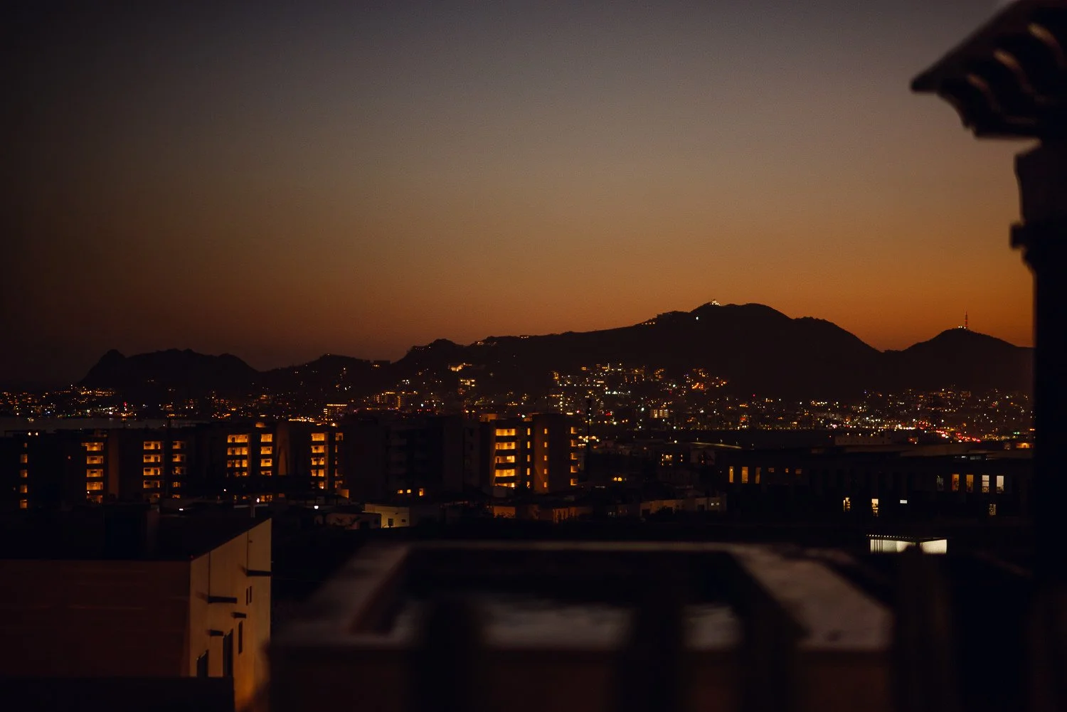 Travel photography of city lights at dusk in Cabo San Lucas, Mexico