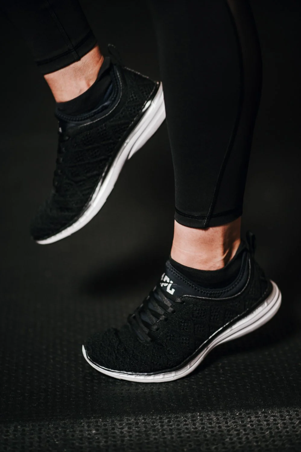 Lifestyle photograph of APL shoes at Beautifully Savage boutique boxing gym in Fort Collins, Colorado