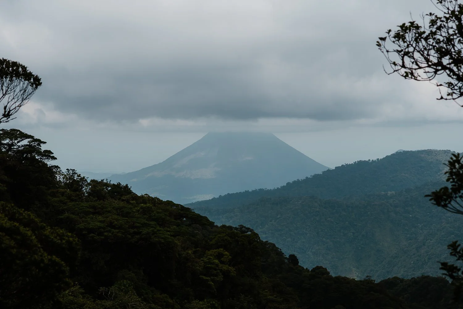 travel photography of a dormant volcano from a trail in Monteverde cloud forest in Costa Rica