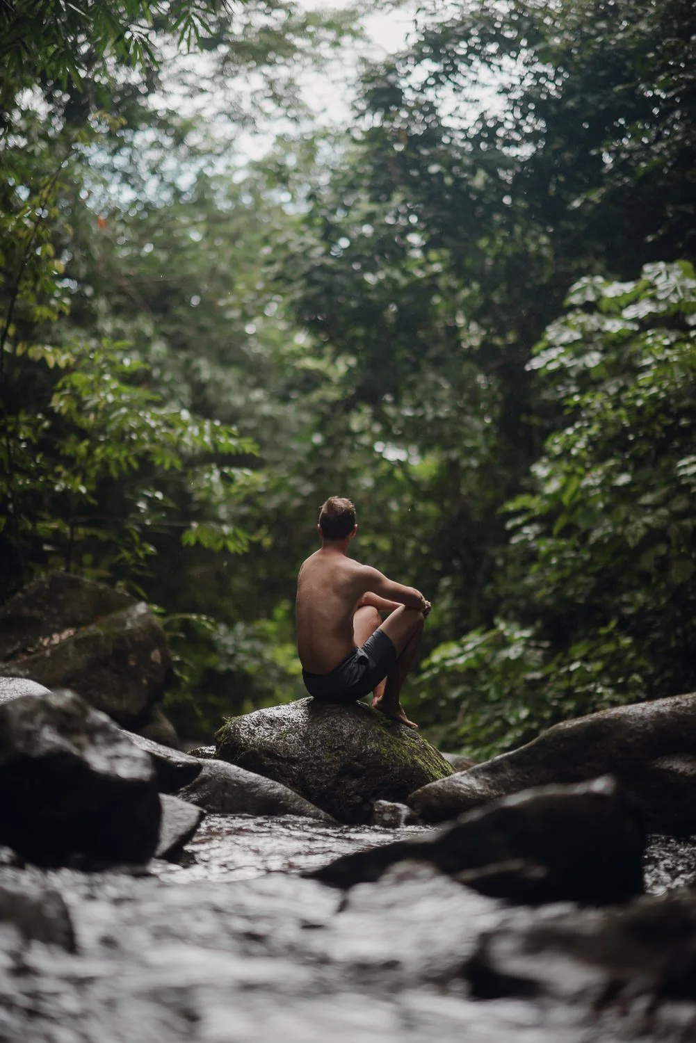Travel photography of a man near Nuayaca Falls in Uvita, Costa Rica