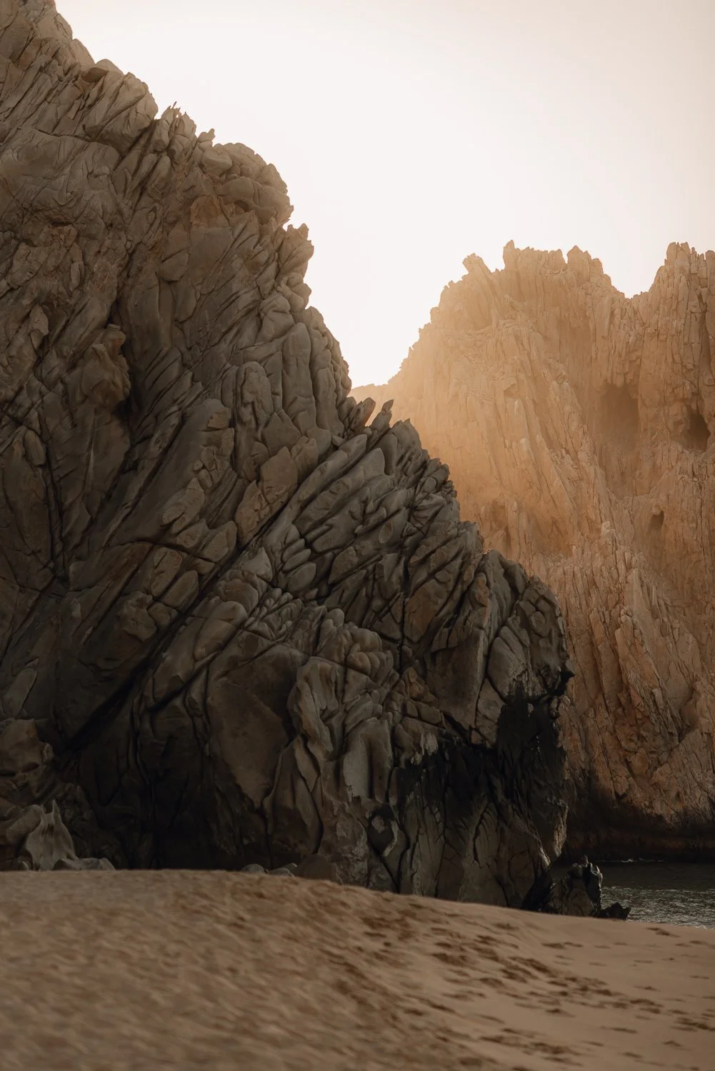 Nature landscape photography of unique rock formations during sunrise at Lover's Beach in Cabo San Lucas, Mexico