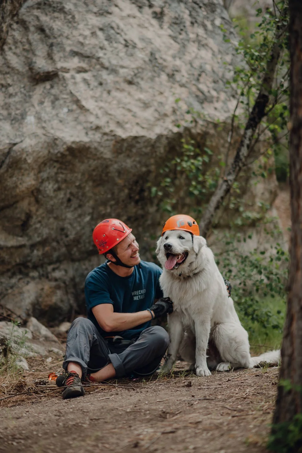 Professional adventure photography in Spokane, Washington - lifestyle portrait rock climbing dog wearing helmet