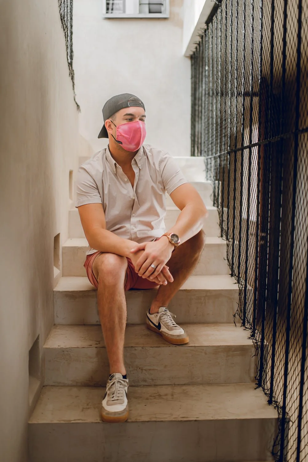 Professional product & branding photography for Sea'sons official face masks - lifestyle portrait with pink mask in Isla Holbox, Mexico.