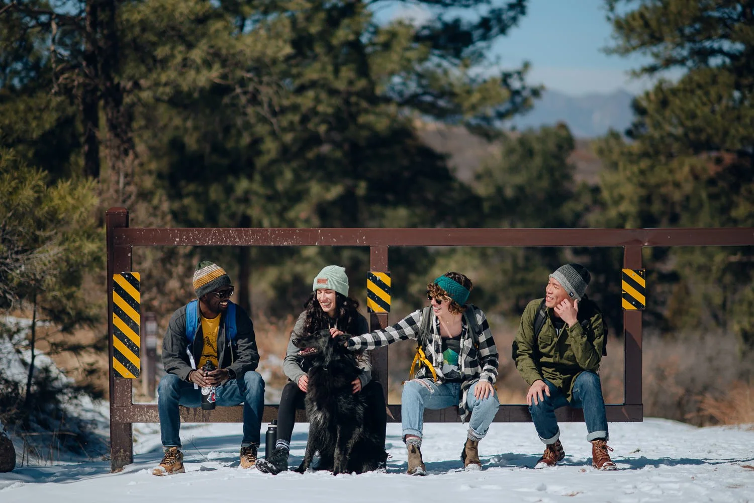 Professional lifestyle photography of a young group of friends in the snowy mountains in Colorado Springs, Colorado
