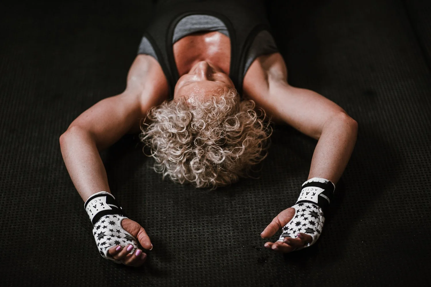 Lifestyle photograph of woman boxer wearing Kali Active hand wraps at Beautifully Savage boutique boxing gym in Fort Collins, Colorado