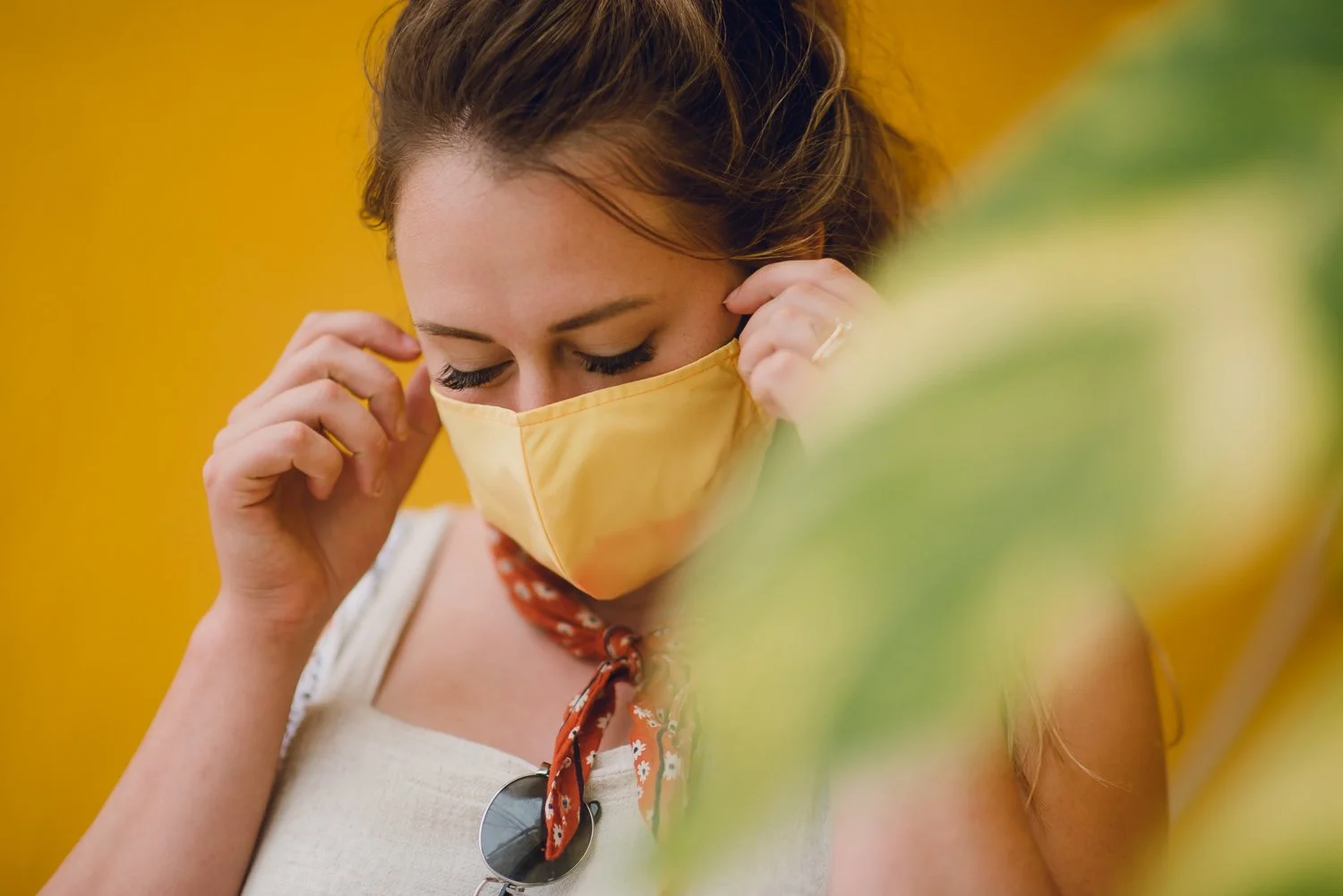 Professional product & branding photography for Sea'sons official face masks - lifestyle portrait with yellow mask in Isla Holbox, Mexico.