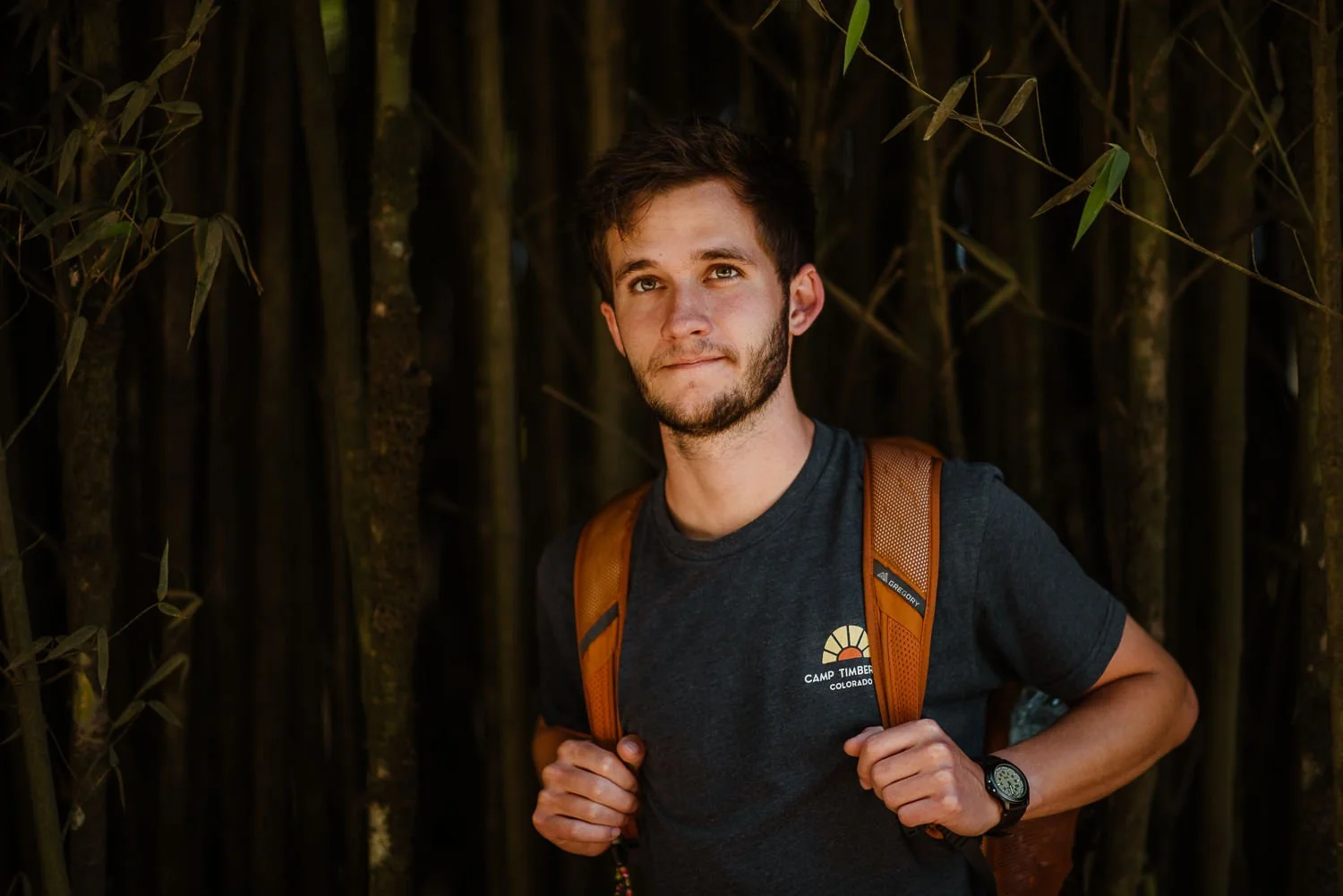 travel portrait photograph of a young hiker exploring on a trail in Monteverde cloud forest in Costa Rica