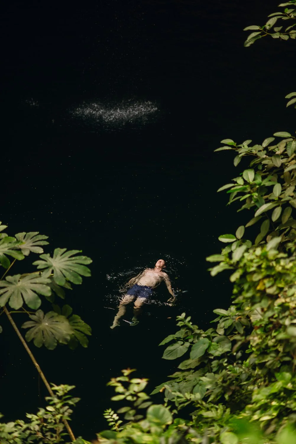 Professional travel photography in Tulum, Mexico - Best cenotes near Tulum, traveler swimming in Cenote Zaci