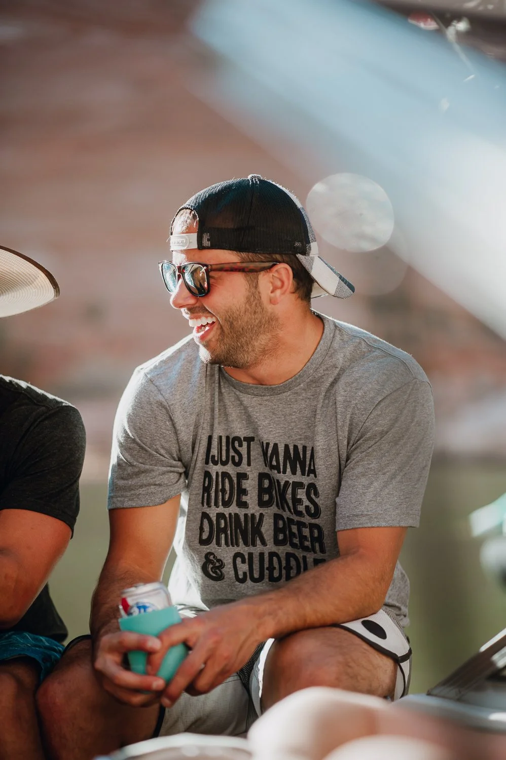 Adventure lifestyle photography of a young man wearing an Akinz tshirt on a boat on Lake Powell in Utah