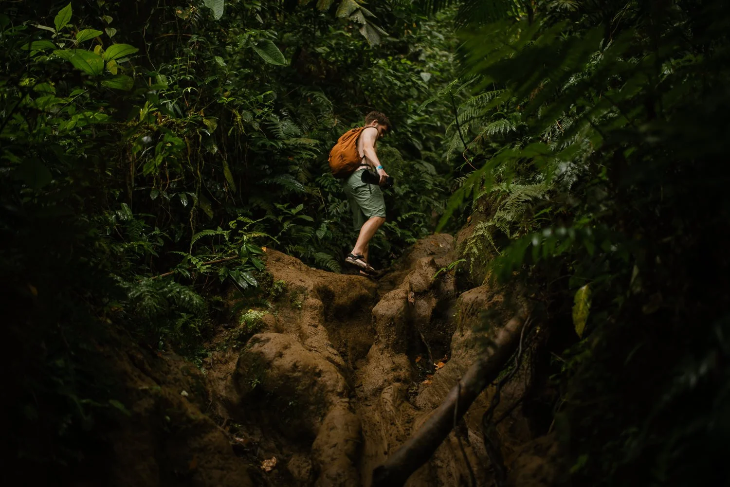 Landscape photograph of a young man hiking Cerro Chato in Costa Rica