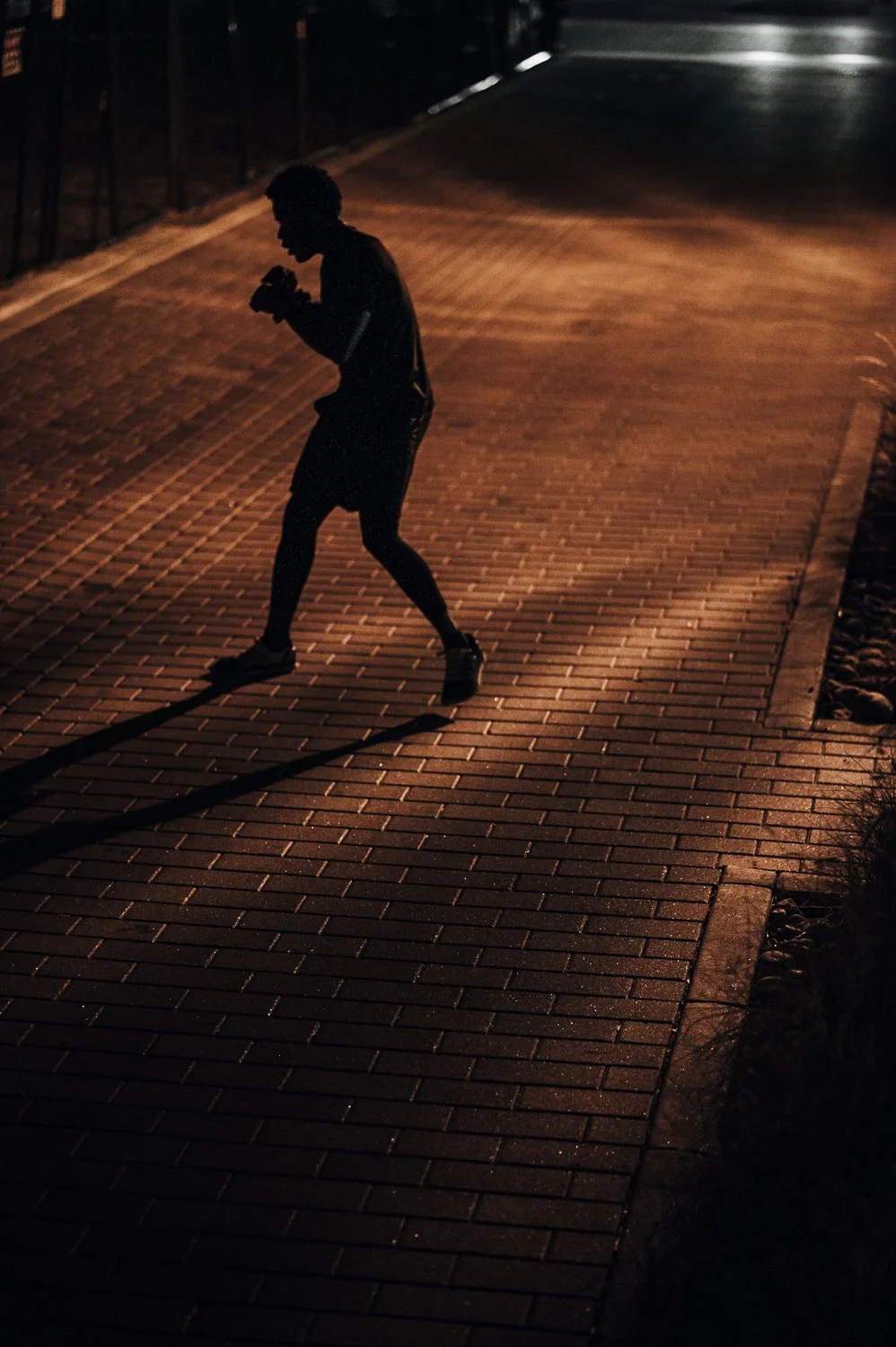Lifestyle photograph of a silhouette at Beautifully Savage boutique boxing gym in Fort Collins, Colorado