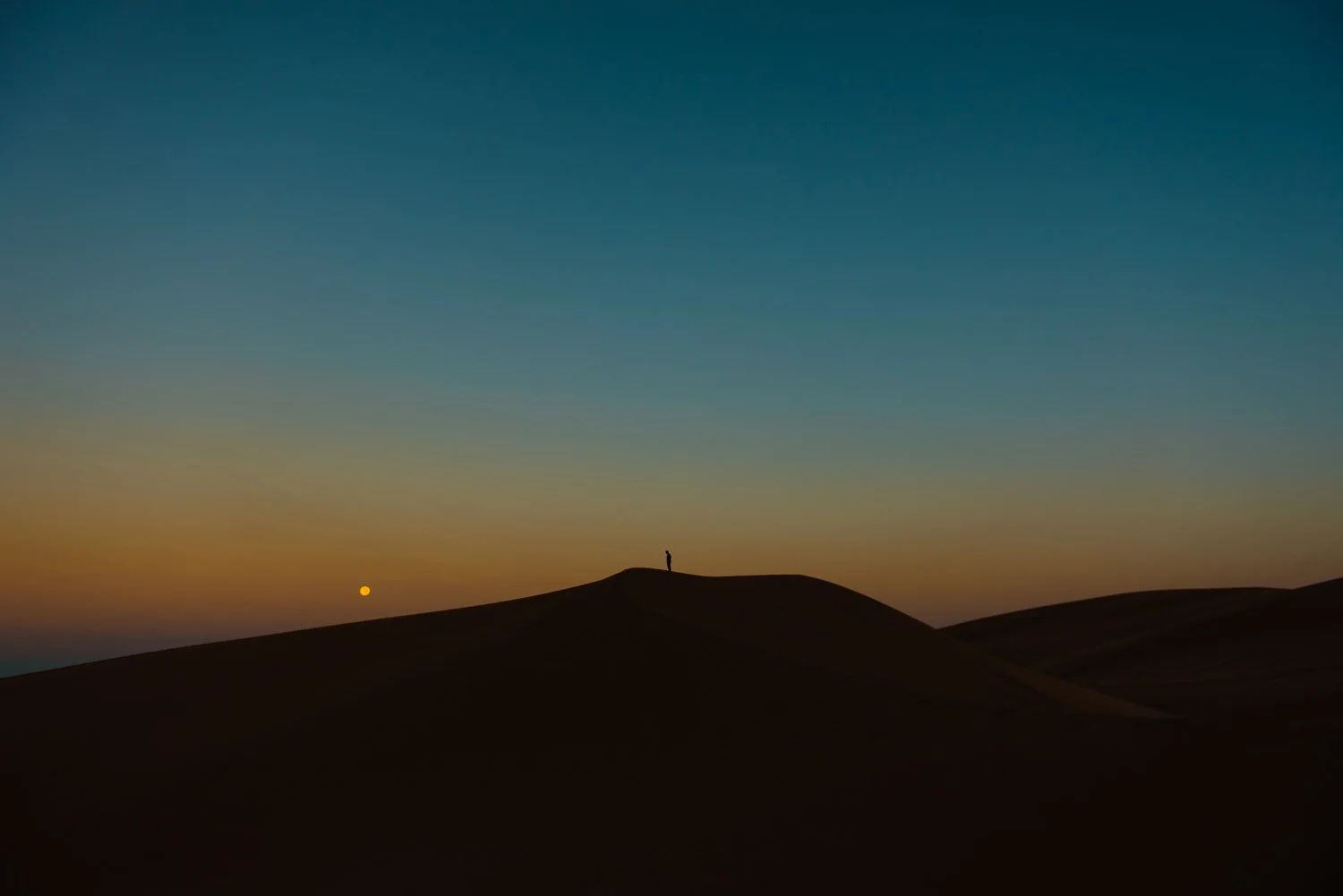 Adventure lifestyle photography of sunrise in Great Sand Dunes National Park in Colorado