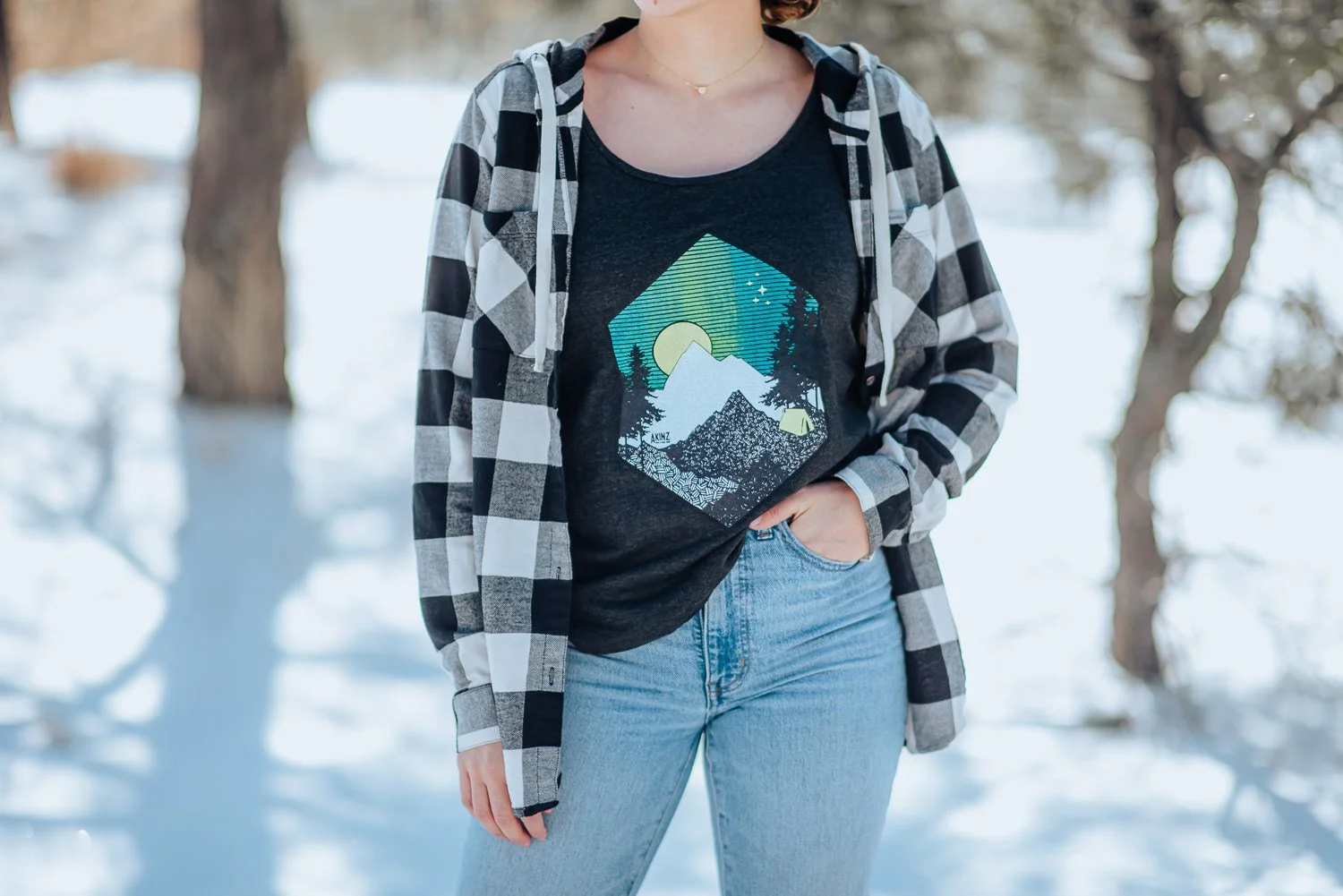 Professional lifestyle photography of young  model wearing Akinz Boardwear clothing in the snowy mountains in Colorado Springs, Colorado