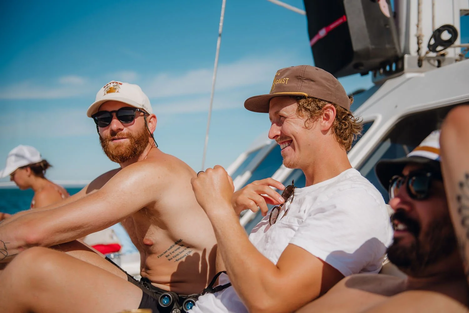 Ryan-Waneka-Photography-2022-La-Paz-Mexico-10-guys-laughing-sailing.jpg