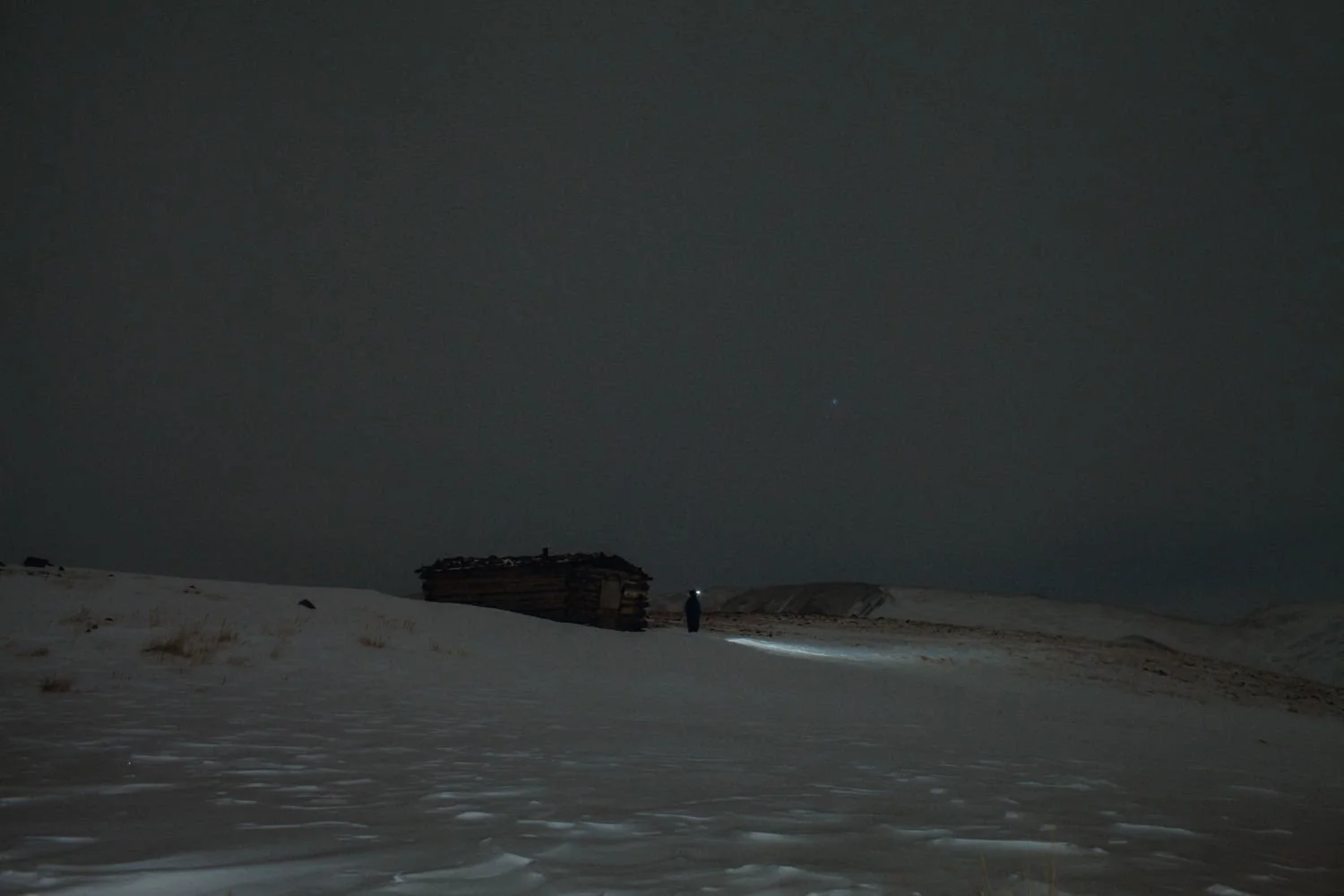 Adventure night photography near Breckenridge, Colorado - snowshoeing winter hut trip