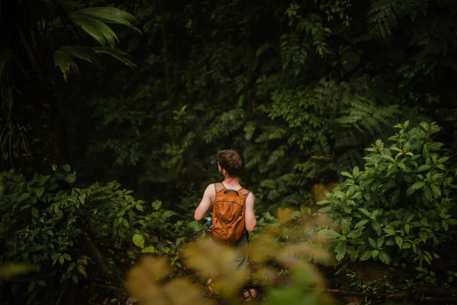 Landscape photograph of a young man hiking Cerro Chato in Costa Rica