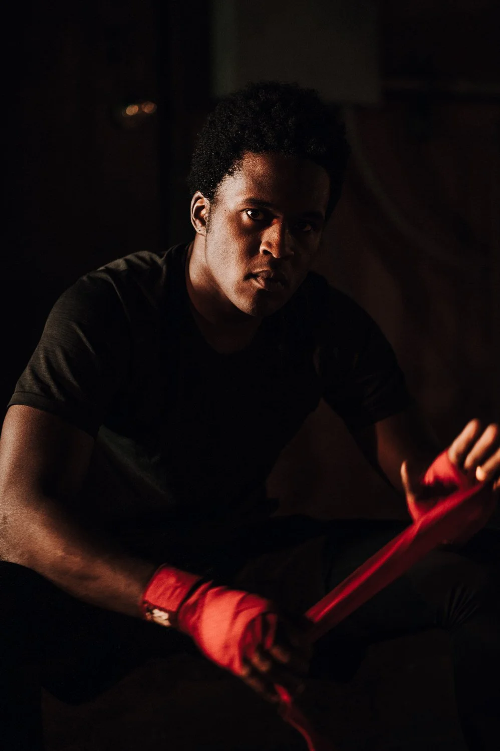 Dramatic Lifestyle photograph of a young athlete at Beautifully Savage boutique boxing gym in Fort Collins, Colorado