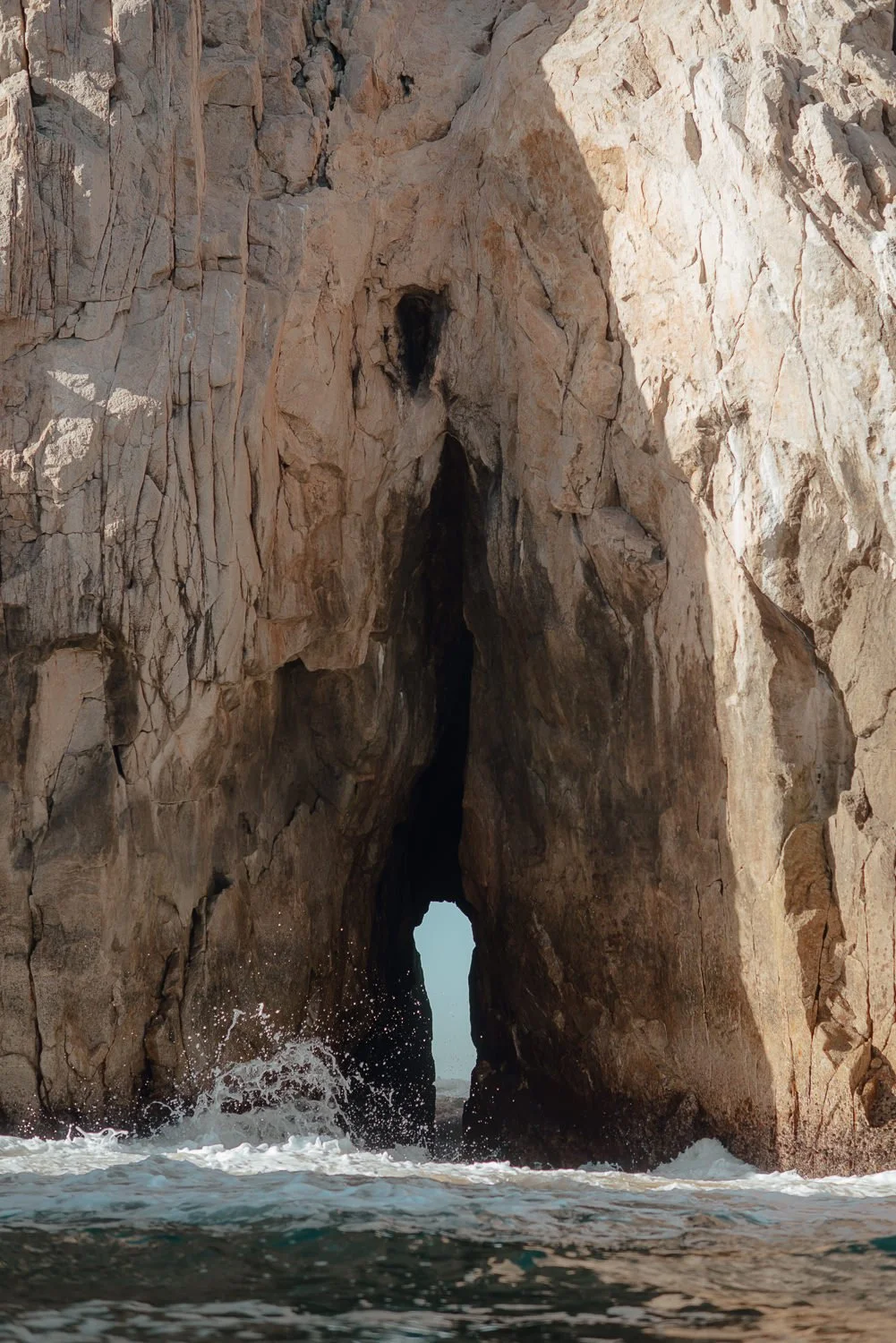 Landscape photography of the famous arch and unique rock formations at Lover's Beach in Cabo San Lucas, Mexico