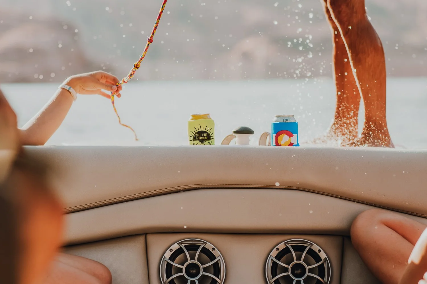 Adventure lifestyle photography of Akinz coozies on a boat on Lake Powell in Utah