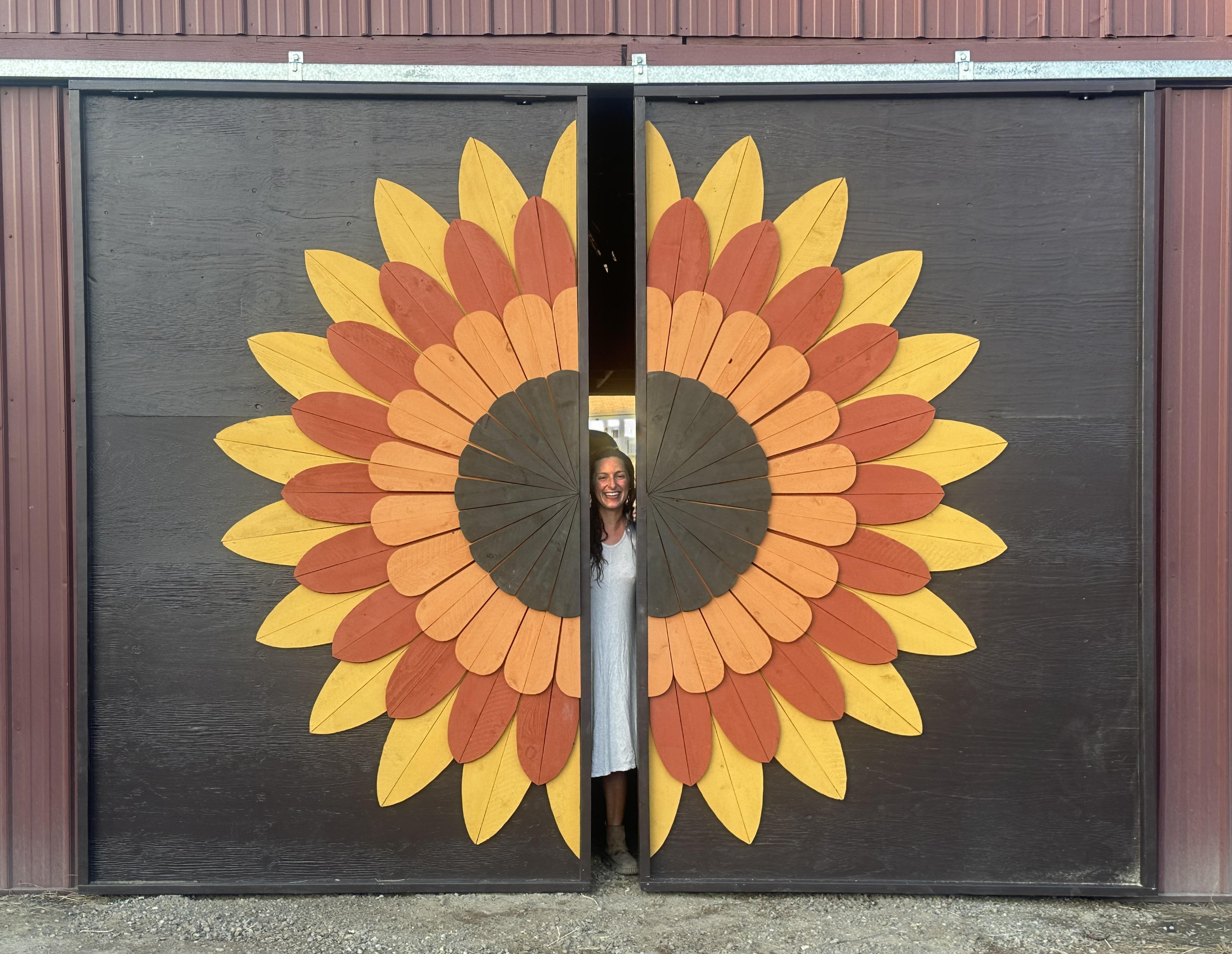 This beautiful flower built onto the new doors for our horse barn radiates warmly with autumn colors.

Designed with my partner, Nicole, and built with Nicole and my dad, Greg. 