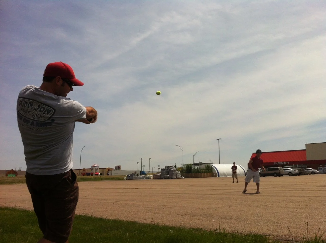 Playing some pre-storm sporty ball in the Pamida parking lot in Ogallala, Nebraska