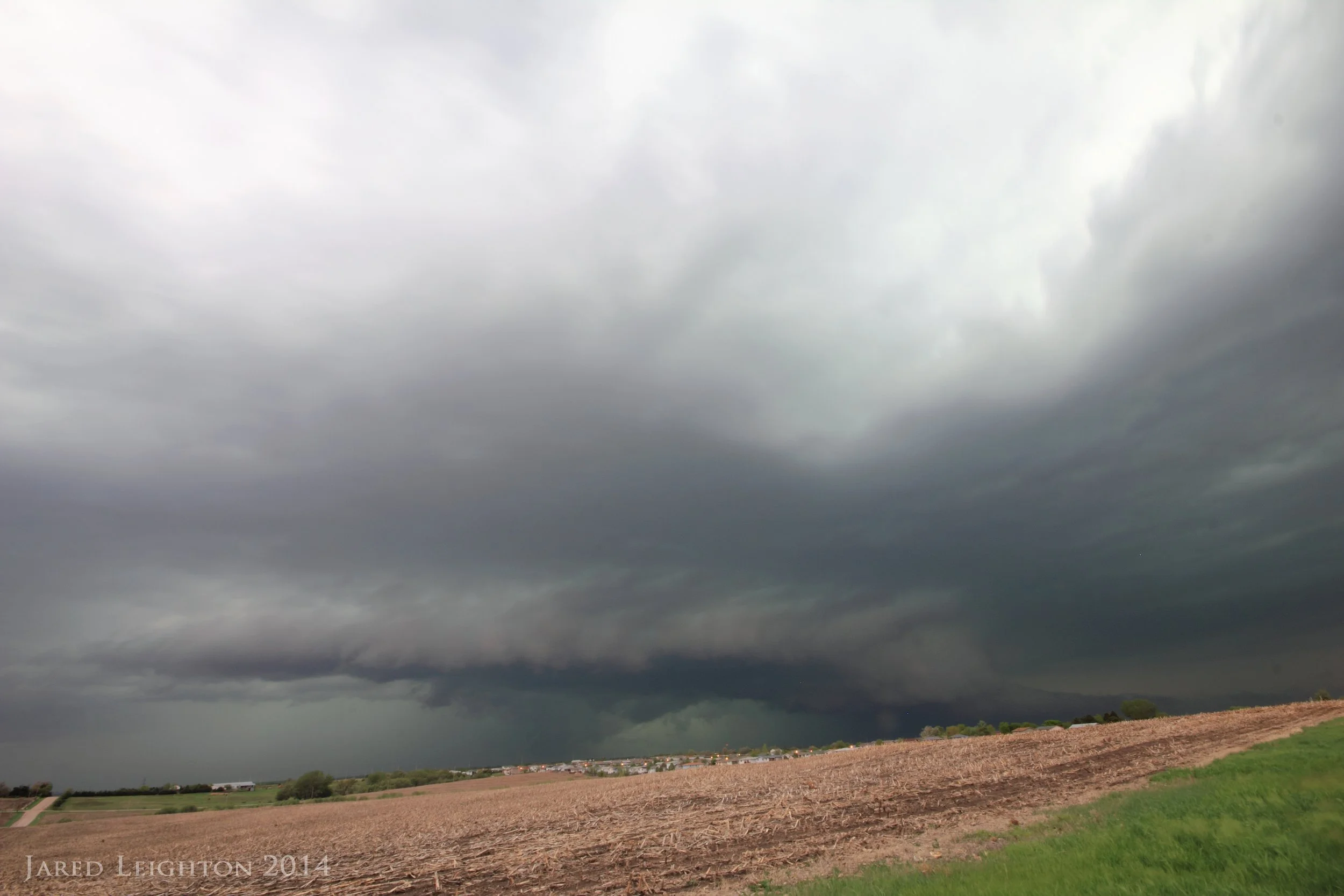 RFD shelf cloud wraps around the southern flank of the storm NW of Lincoln, Nebraska. In the distance is an EF-2 tornado