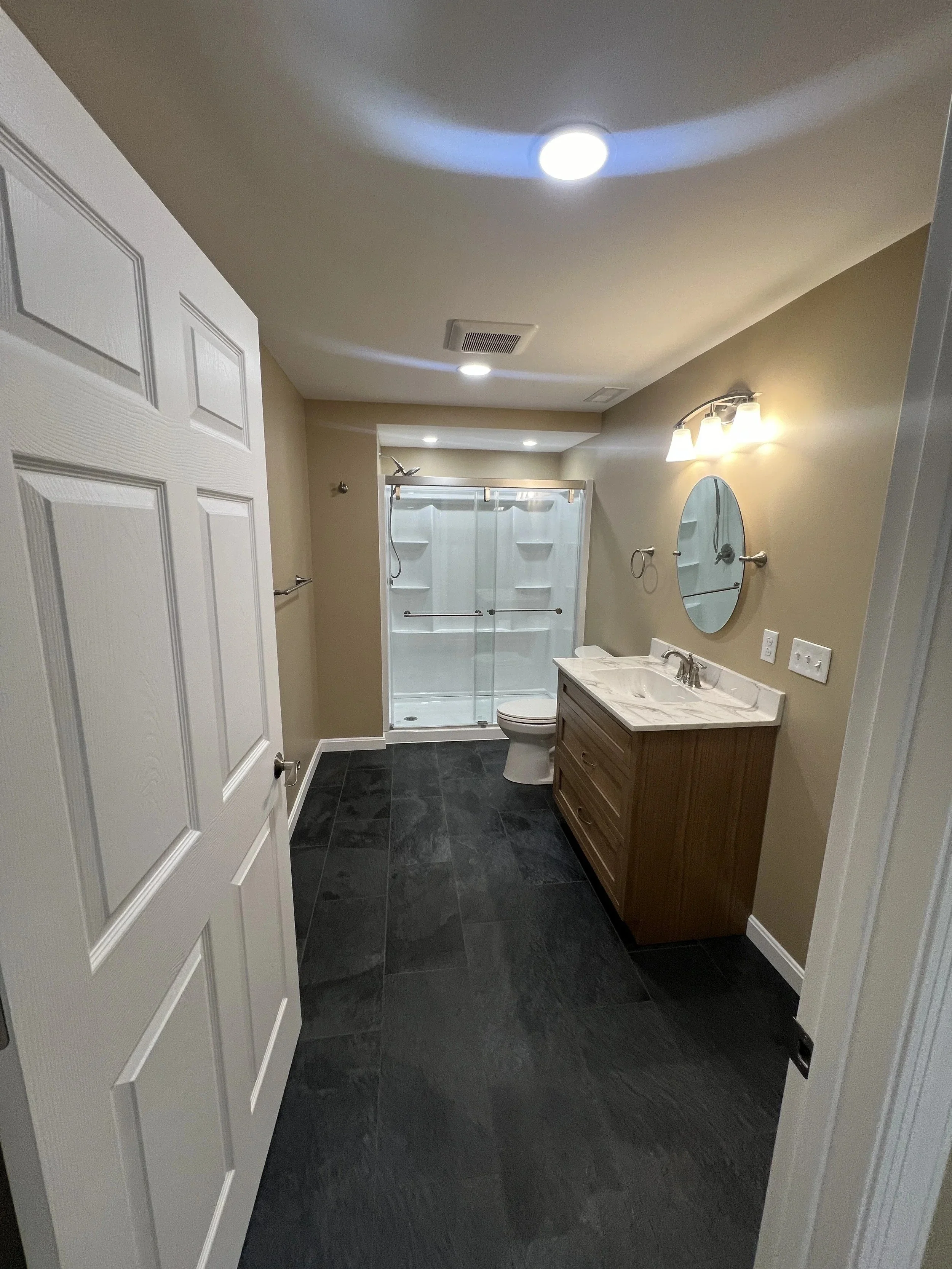Basement bathroom with vanity, toilet and walk-in shower, Belle Vernon PA