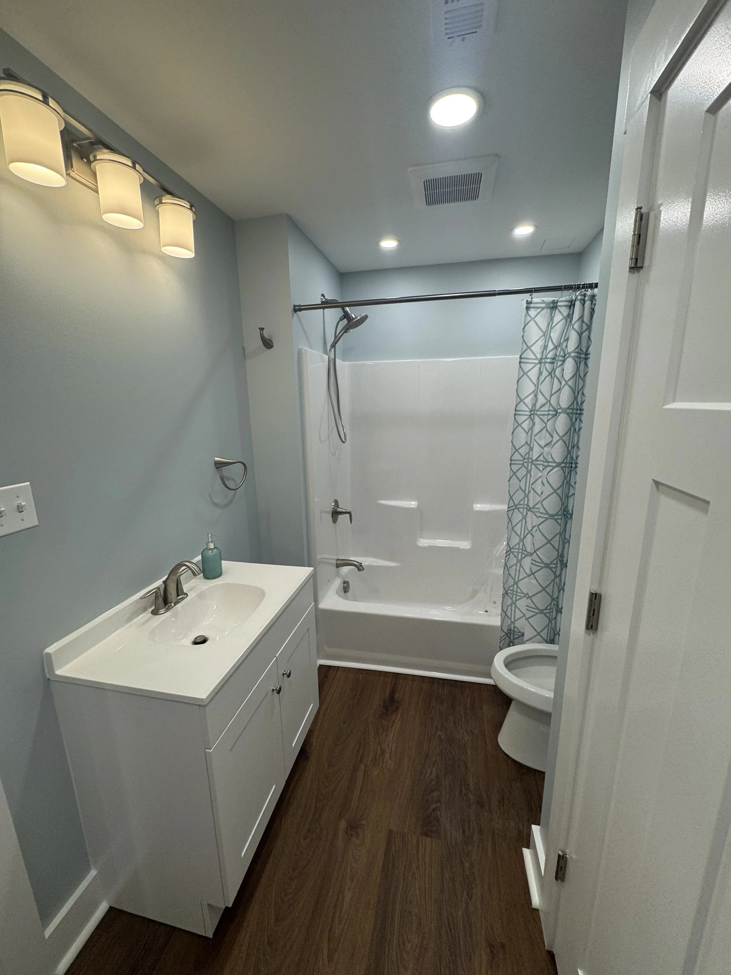 Basement bathroom with vanity and tub shower, Belle Vernon PA