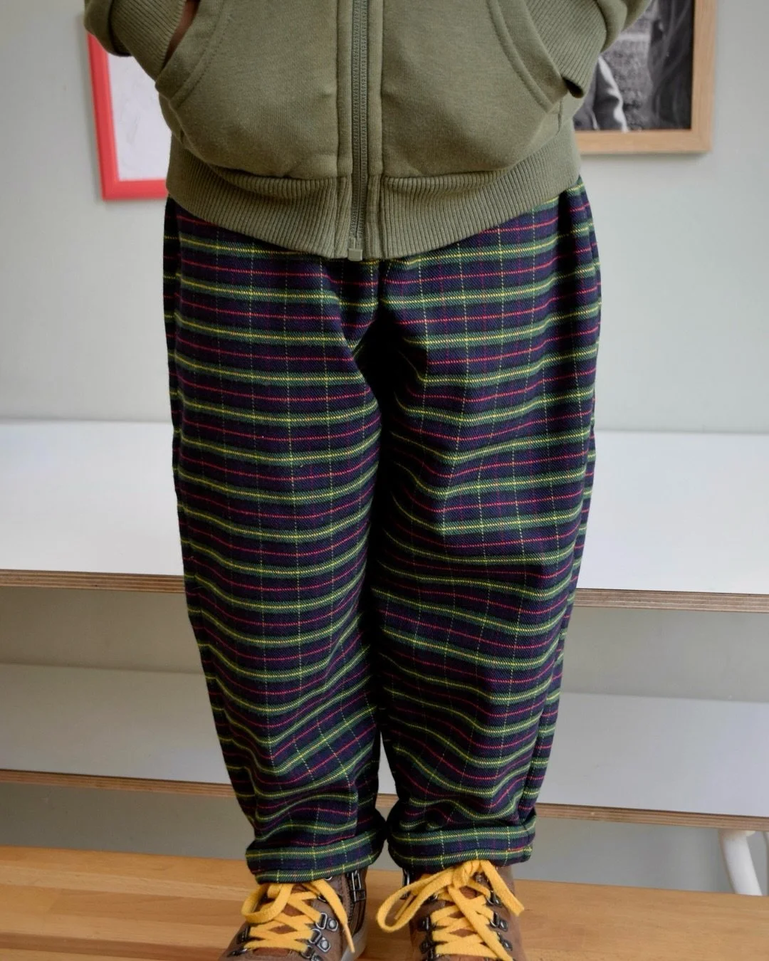 Festive little legs ❤️🪡💚. Handmade tartan trousers for your minis ~ available on the website tomorrow, 8PM! 

Made from vintage fabric, for modern wardrobes. 
.
.
.
#handmadetrousers #tartan #handmadekidsclothes #reclaimedfabric #sustainablekidswea