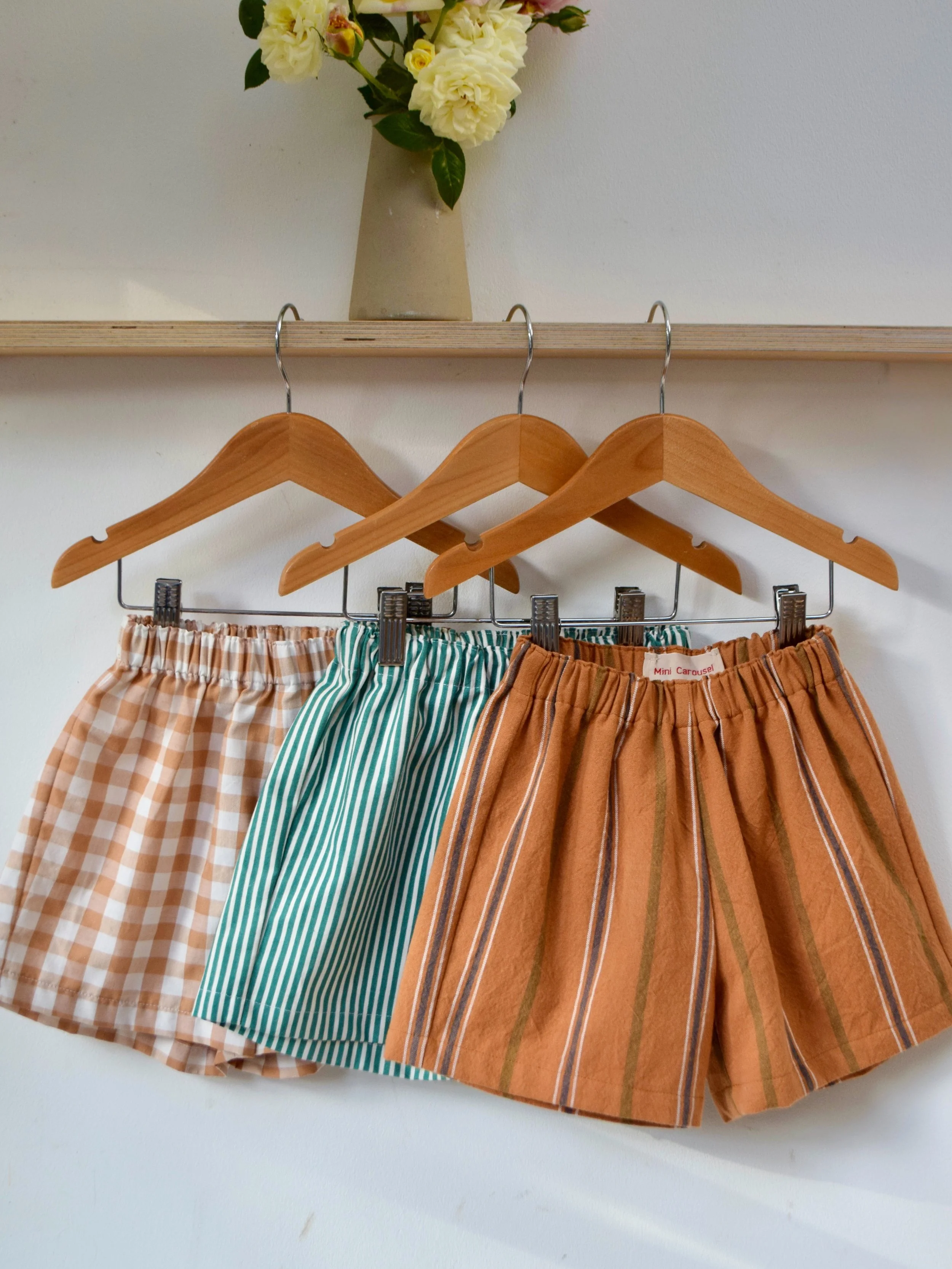 Summer shorts + garden roses. Meet the newest member of our shorts family, yarn dyed tablecloth stripes ~ the colours remind me of golden summer sunsets by the sea 🧡💙

Available to order online next week &amp; at our @turnthetidekids pop up at @tur