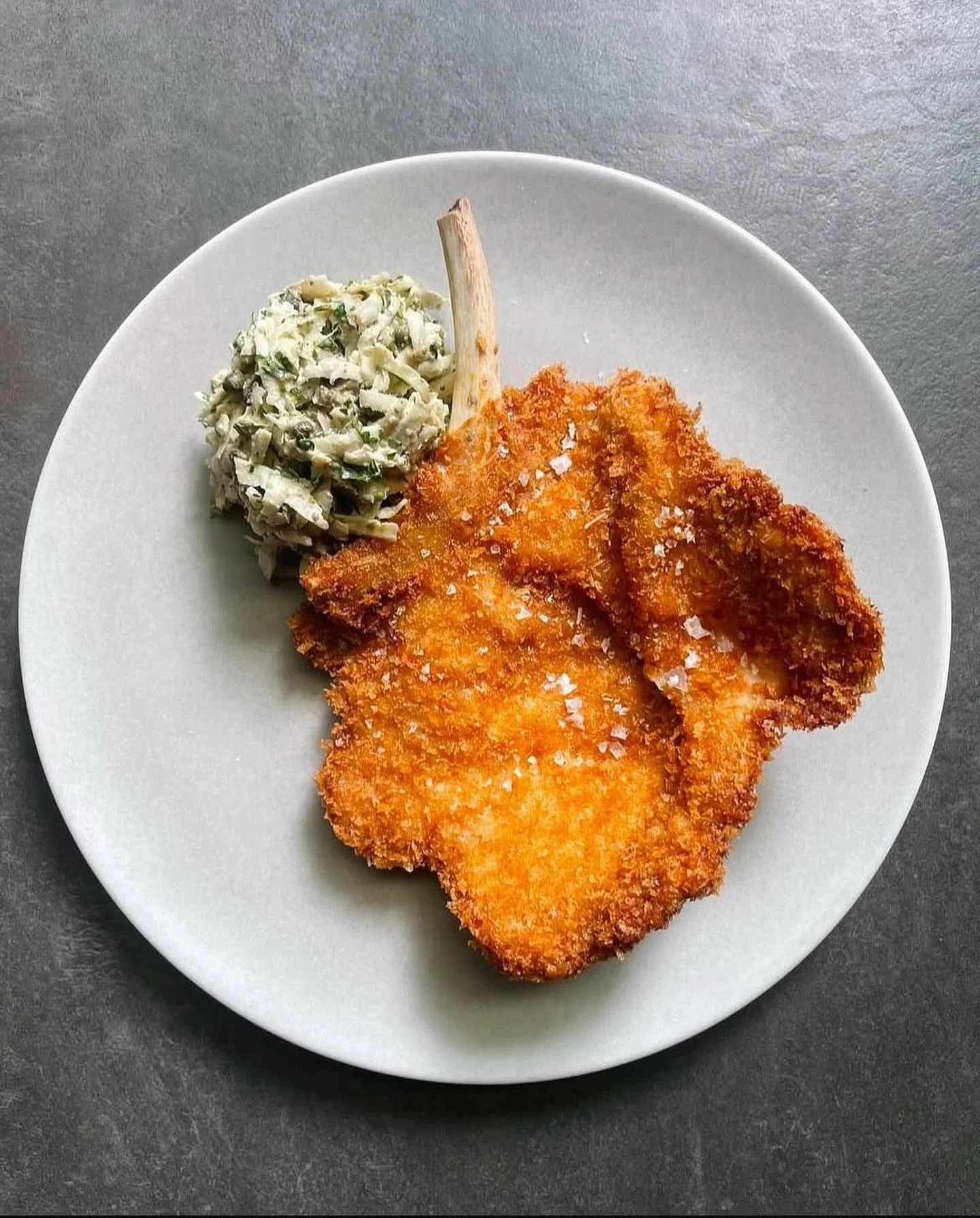 Crispy pork chop Milanese, celeriac, cr&egrave;me fraiche, Barolo vinegar, caper.

📍On the menu only at Golden Square.