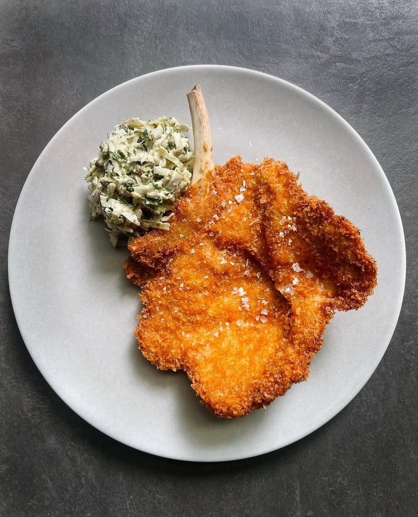 Crispy pork chop Milanese, celeriac, cr&egrave;me fraiche, Barolo vinegar, caper.

📍On the menu only at Golden Square.