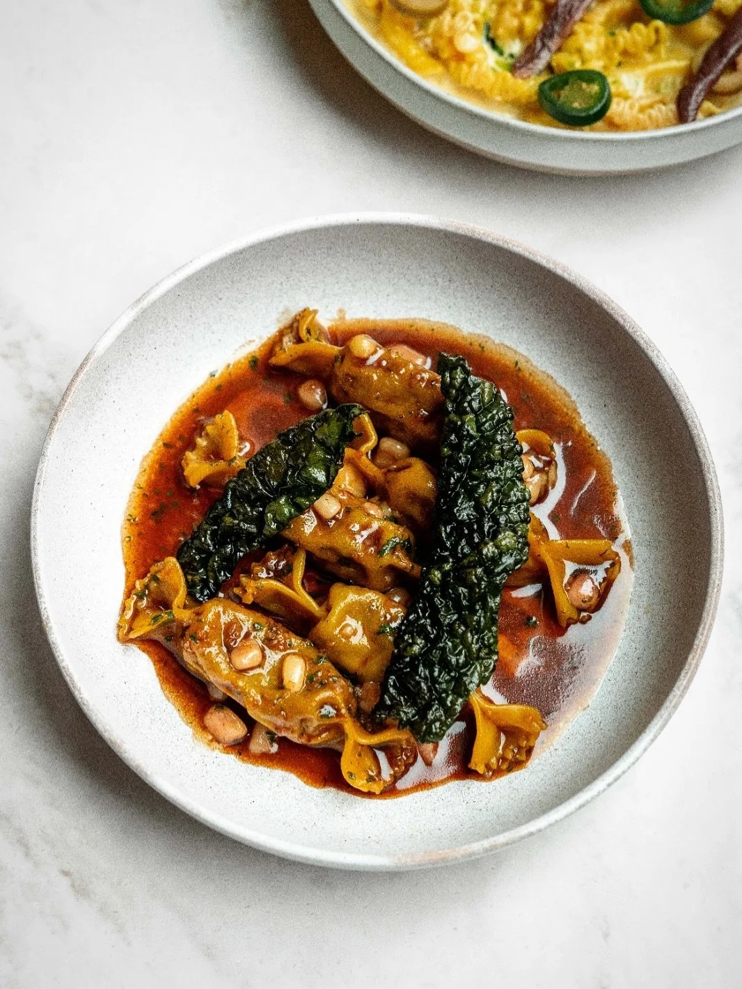 Rare breed beef caramelle, marrowbone, crispy cavolo nero, Barolo.