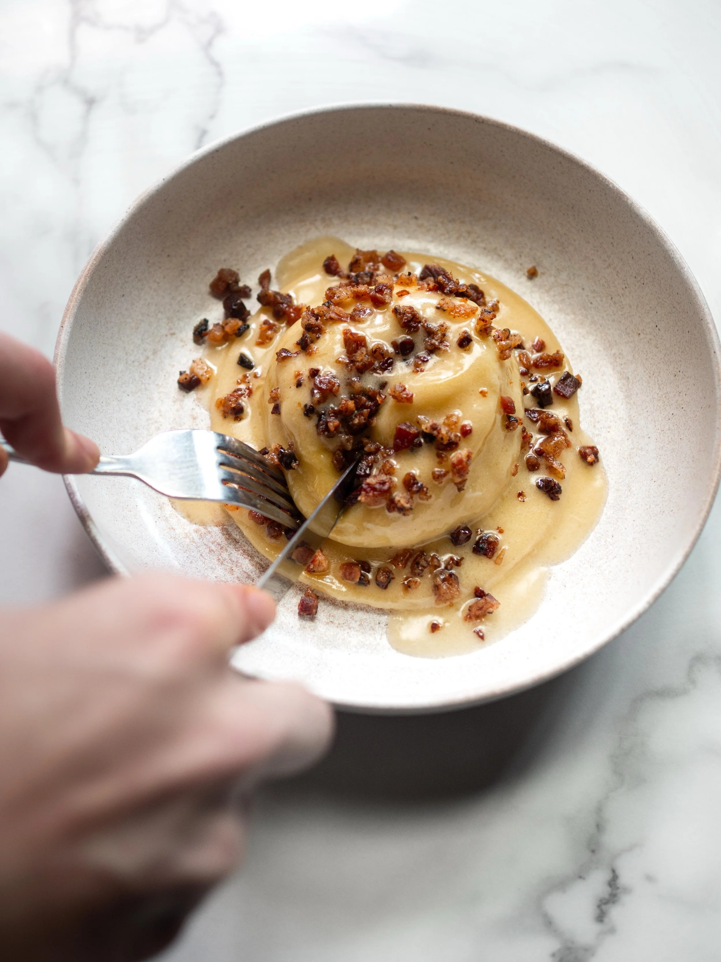 Swipe to see what&rsquo;s inside&hellip;
&lsquo;Carbonara&rsquo; raviolo, crispy guanciale Exclusive to Bancone City. Click the link in bio to book a table.