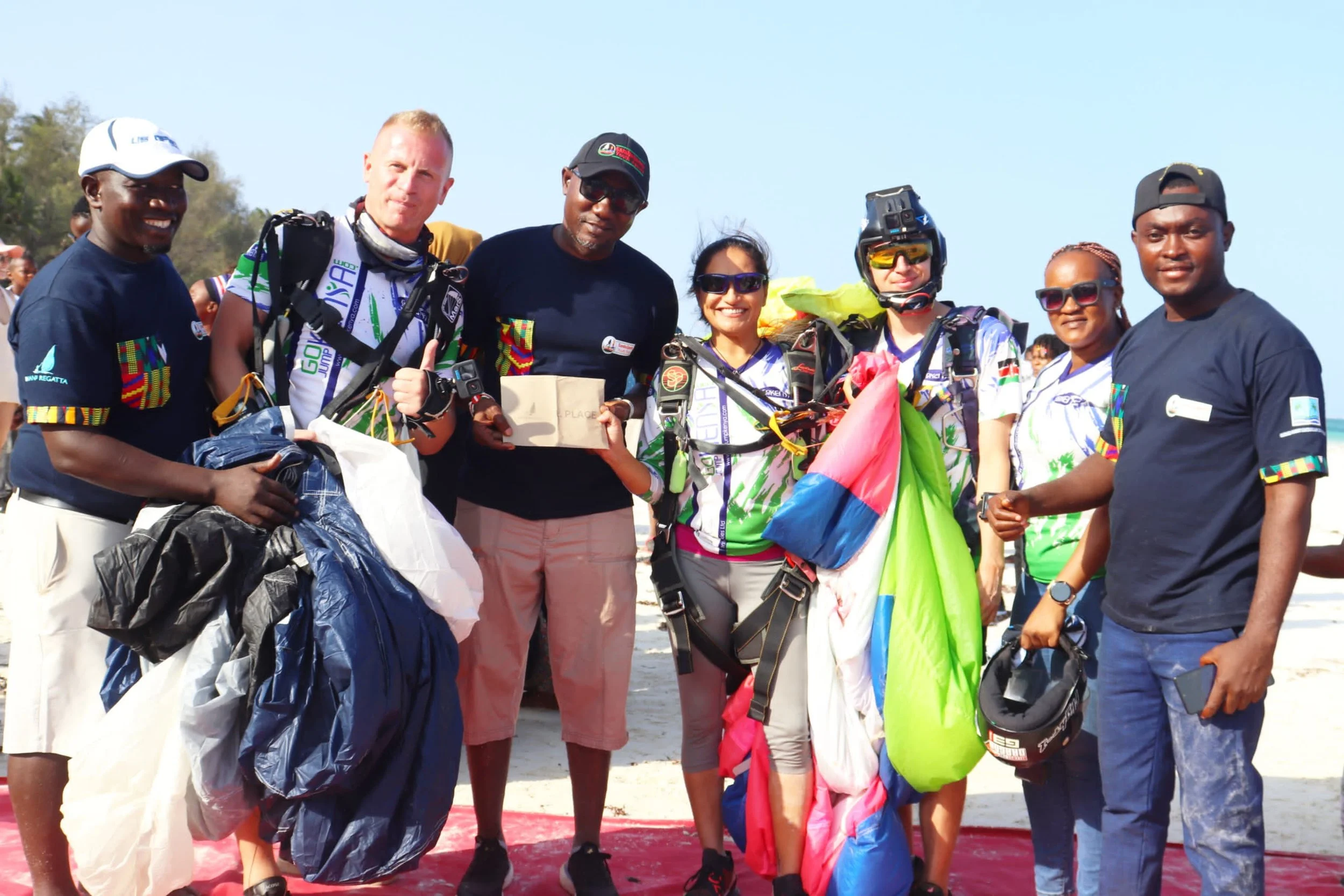 Diani Regata skydivers hand over the prize that soared the sky.jpeg