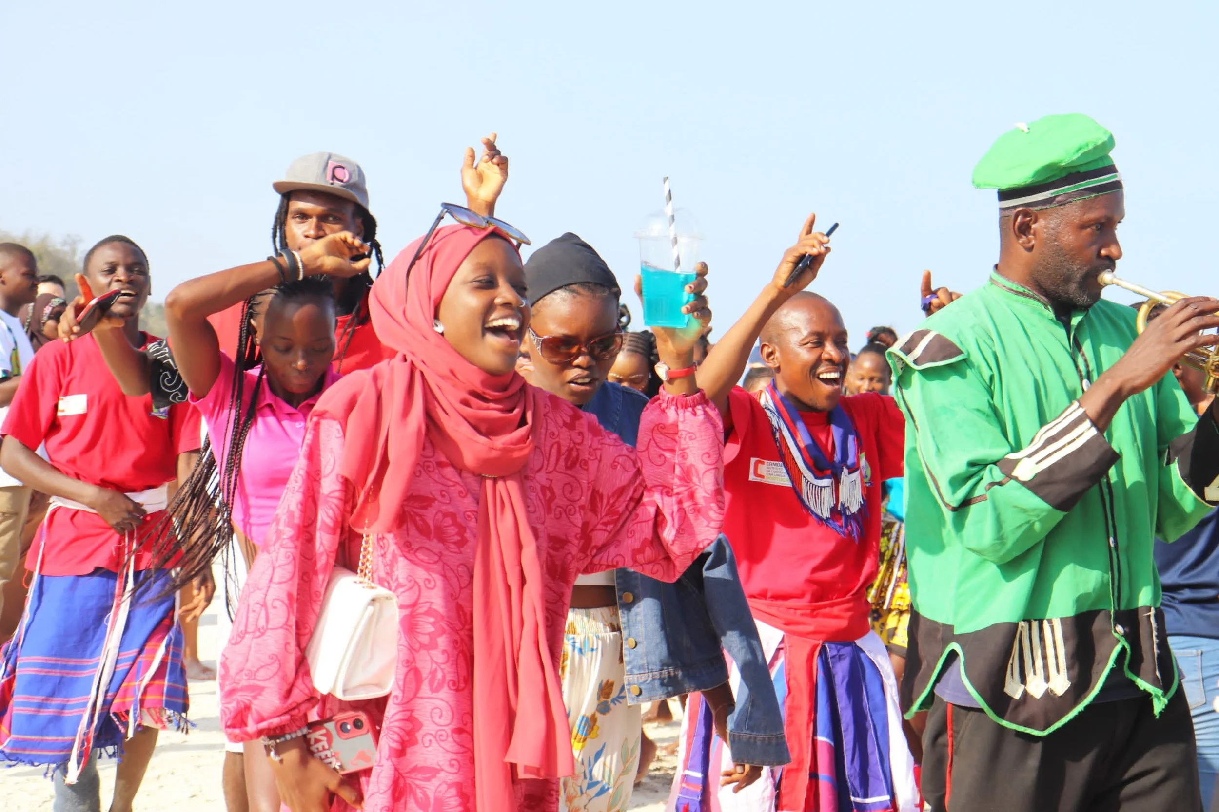 Diani Regata Singing as skydivers land.jpeg
