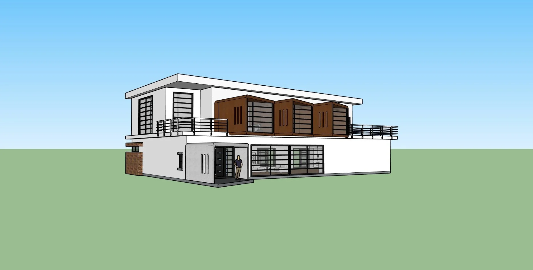 Une maison moderne à deux étages avec des fenêtres en verre, une terrasse en bois, et un homme debout à la porte d'entrée