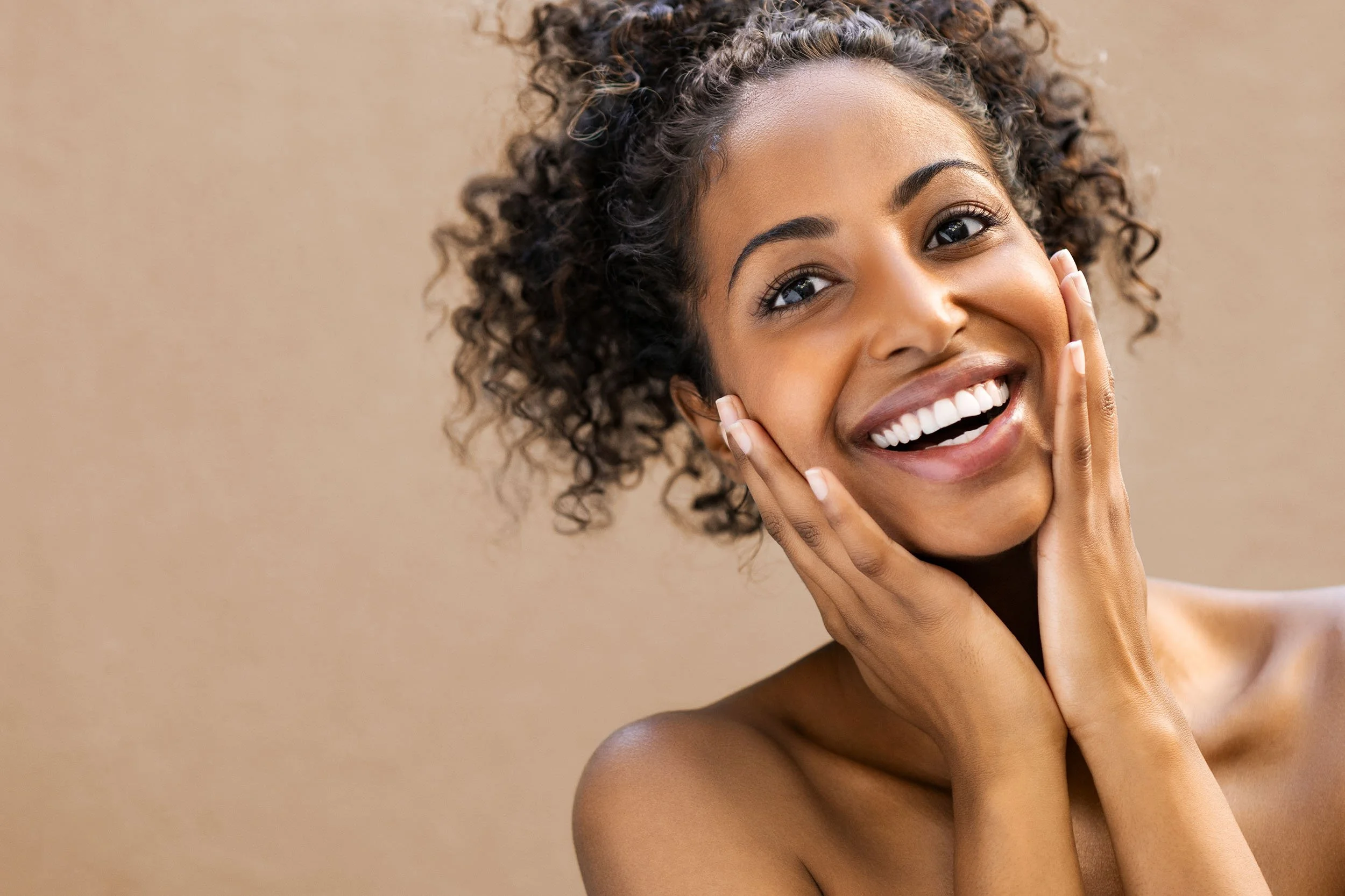 aesthetic-client-woman-of-colour-curly-hair-smile.jpg