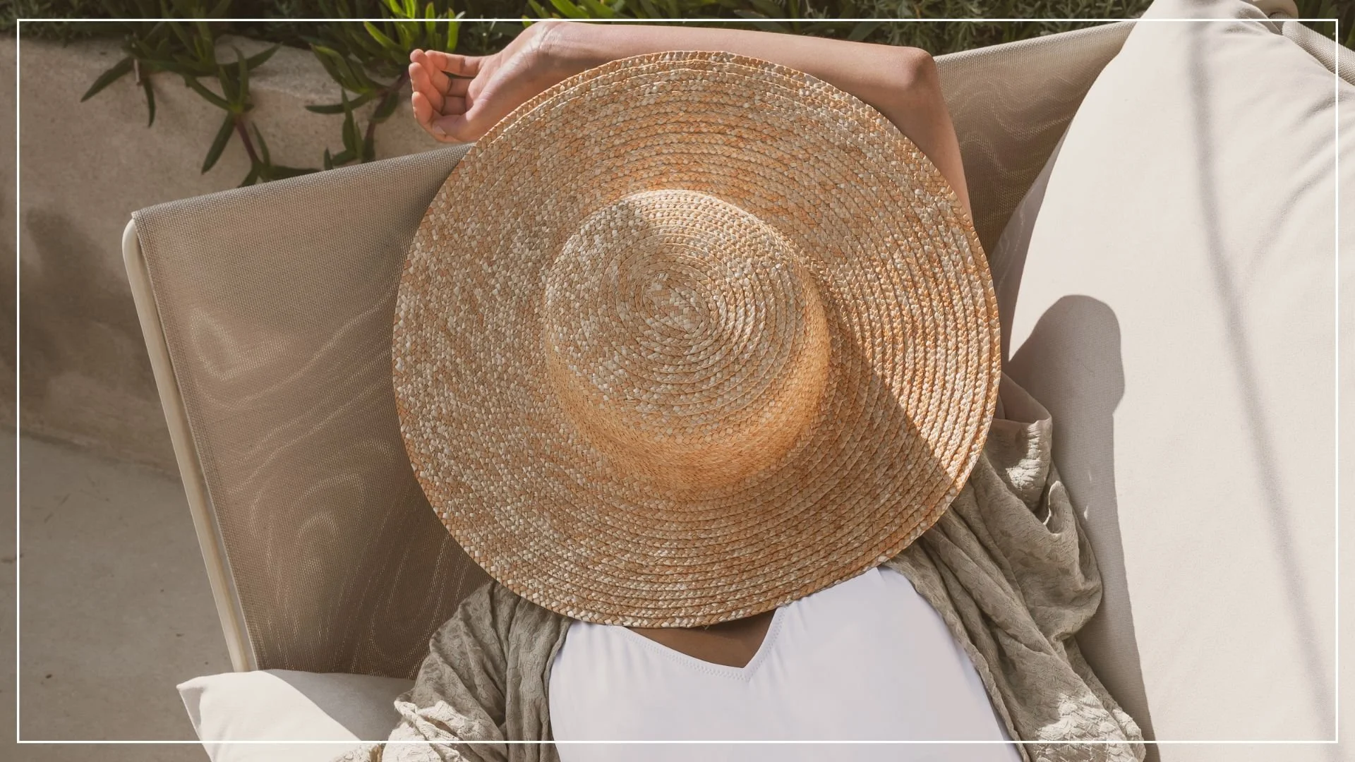woman sleeping in swimming costume with sun hat covering face