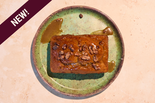 Sweet Potato Loaf topped with bourbon toffee caramel and cocoa nibs.