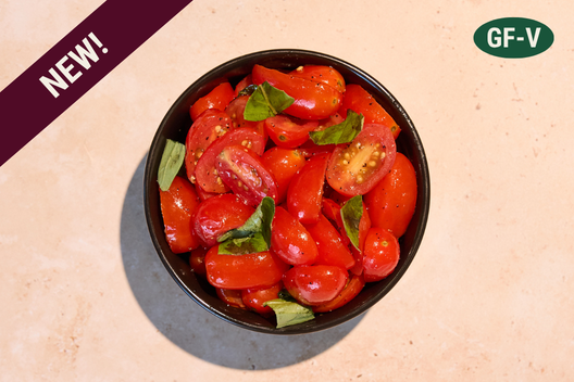 Tomato basil salad with grape tomatoes, basil, chives, and a sherry vinaigrette.