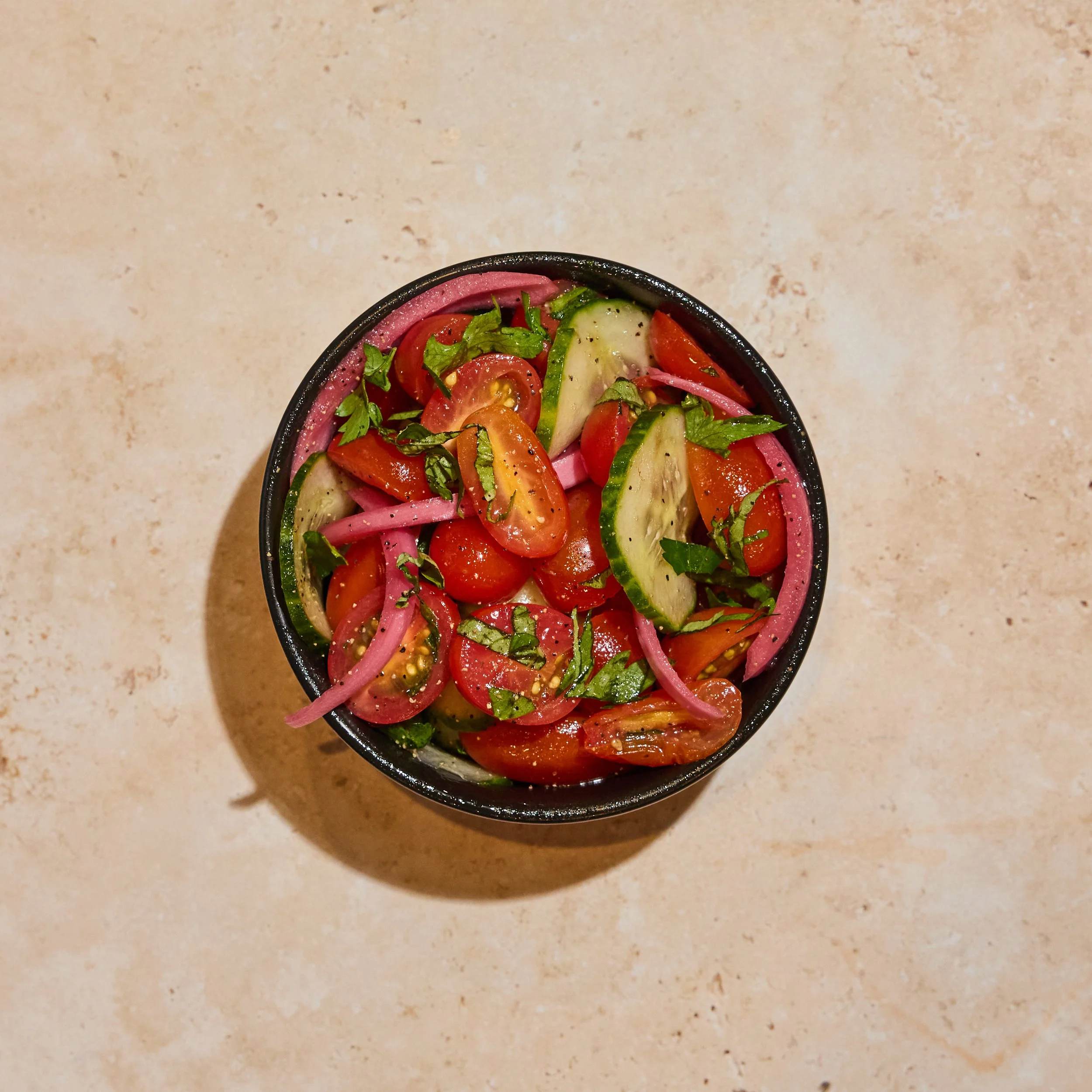Side of locally-sourced, seasonal, Tomato Basil Salad.